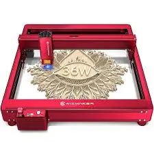 Wizmaker laser engraving machine actively engraving a wood piece