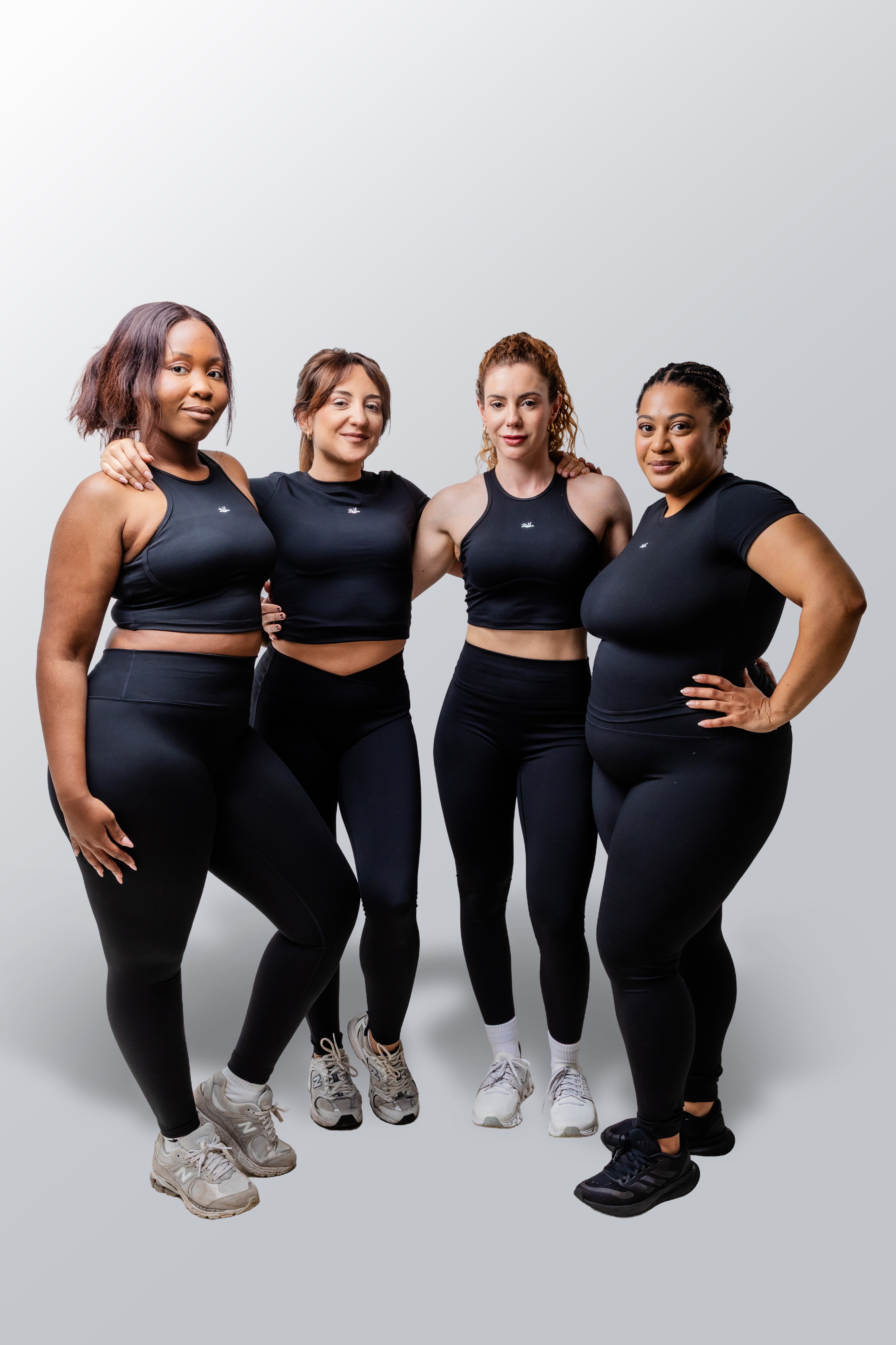 Two women in casual wear representing movement and wellness content.