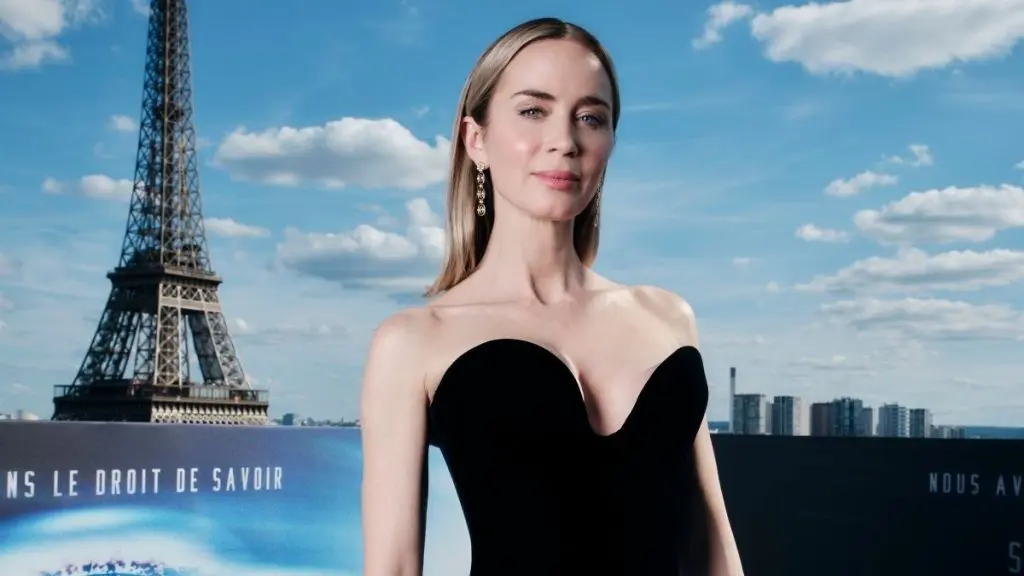 Emily Blunt Stuns in Sheer Top During Paris Press Event