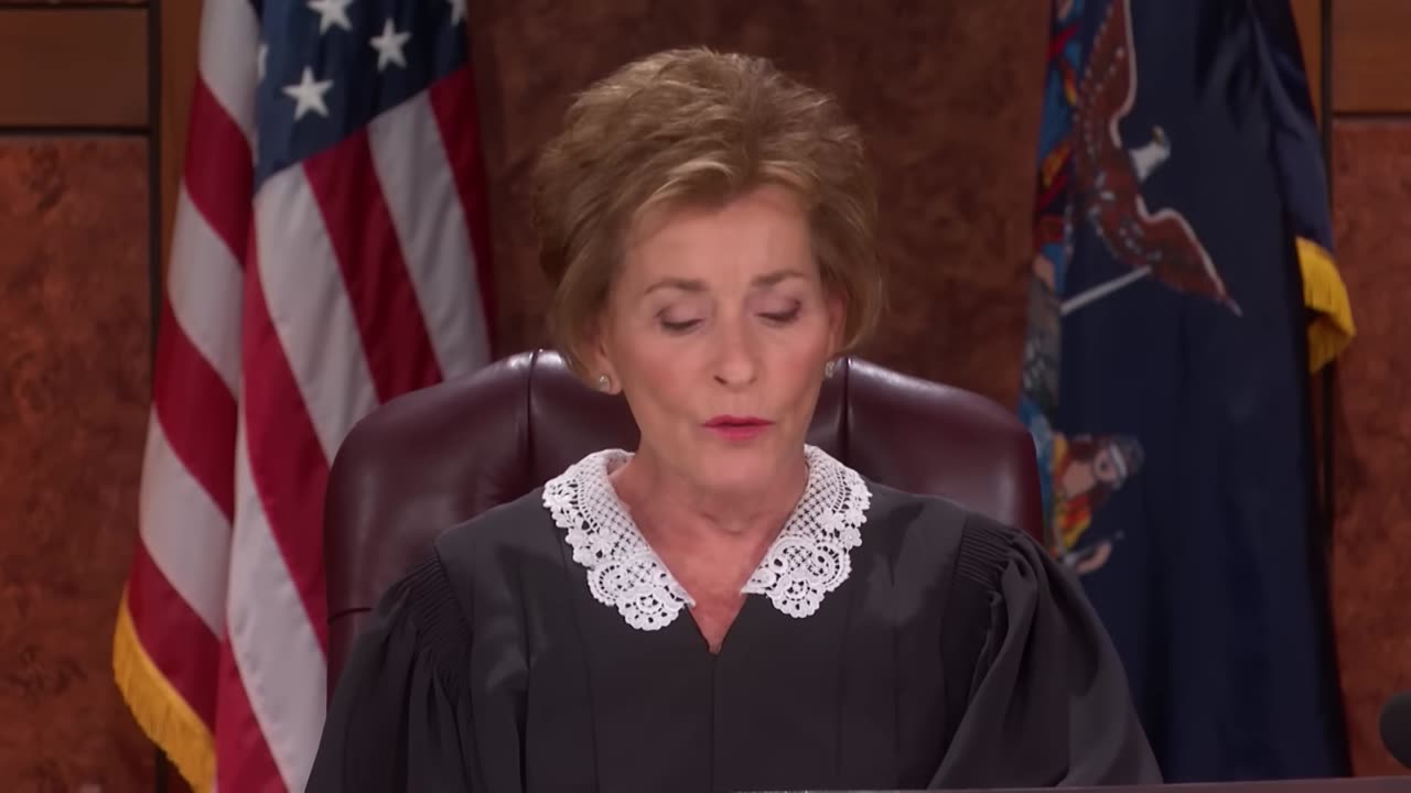 Frame 3 from the courtroom hearing