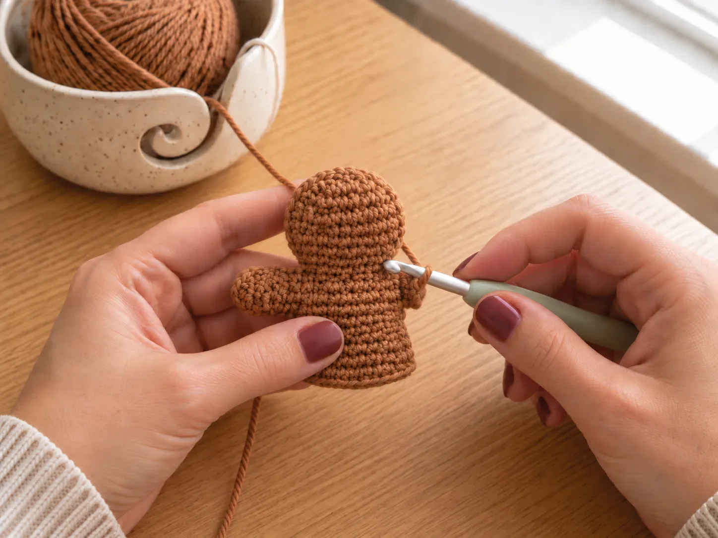 Form the arms — Create the two short arms as part of the body flow so no separate sewing is needed.