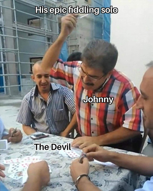 Man-Smacking-Cards-Down-On-Devil