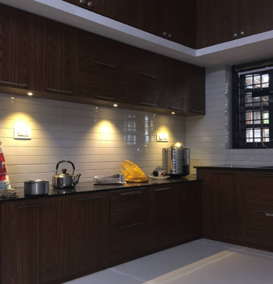 L-shaped modular kitchen interior design project by Dream House