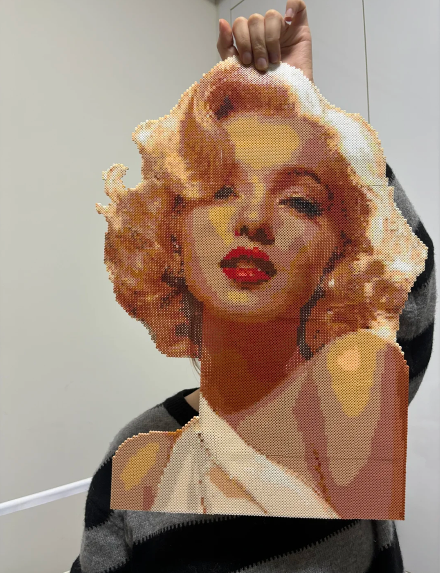 Turning a digital photo into a physical piece of pixel art is a slow, rewarding process. It's about translating light and shadow into individual fuse beads to create a tactile, handmade portrait. This guide covers how to pick the right photo, the assembly process, and why these 3D pieces stand out compared to standard prints.