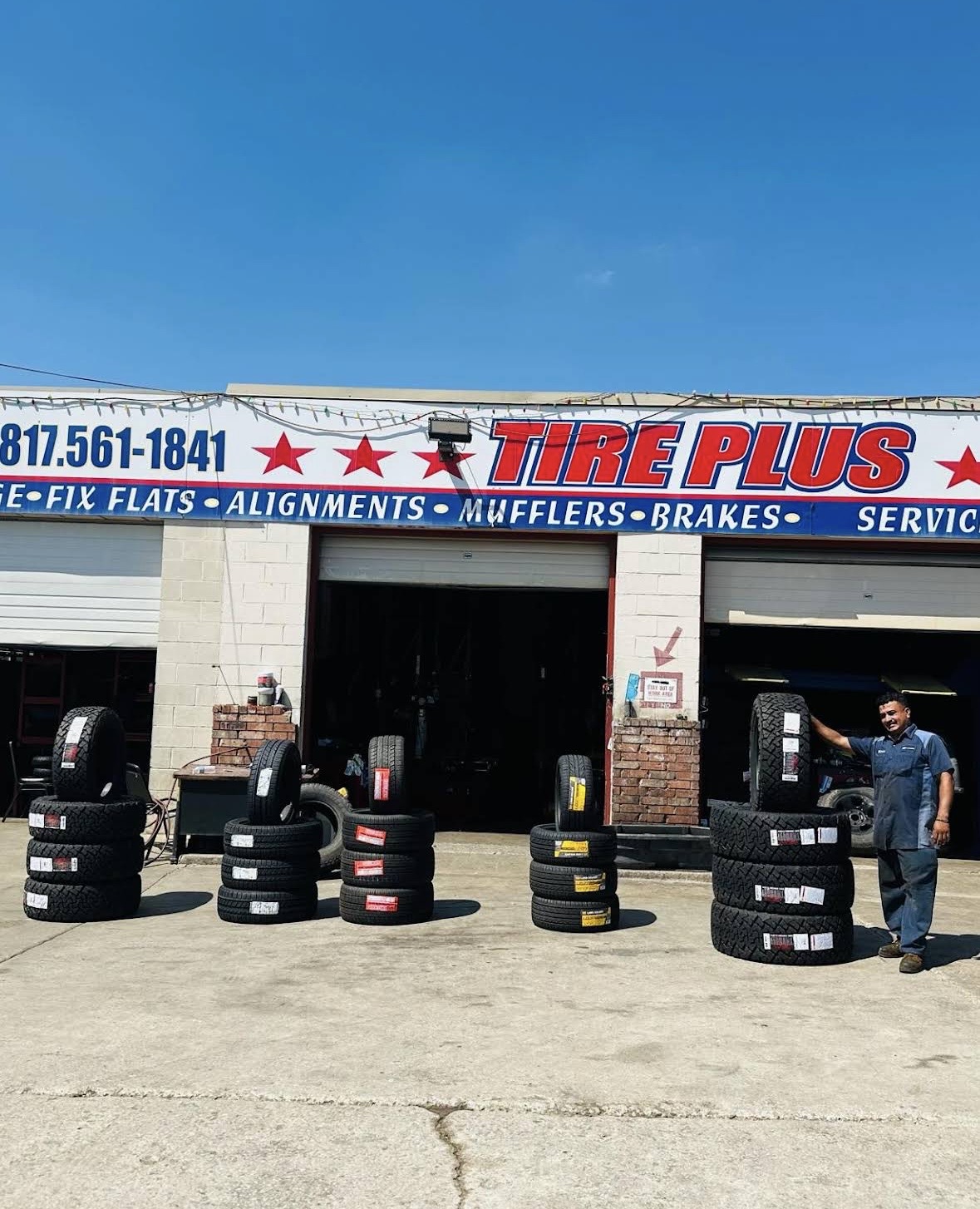 Eddie Tire Plus mechanic servicing a vehicle