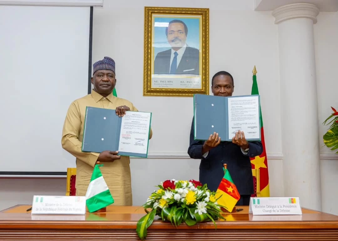 General Christopher Musa (retd), Nigeria's Minister of Defence, with Mr. Joseph Assomo, Cameroon's Minister Delegate for Defence, after signing the MoU in Yaoundé.