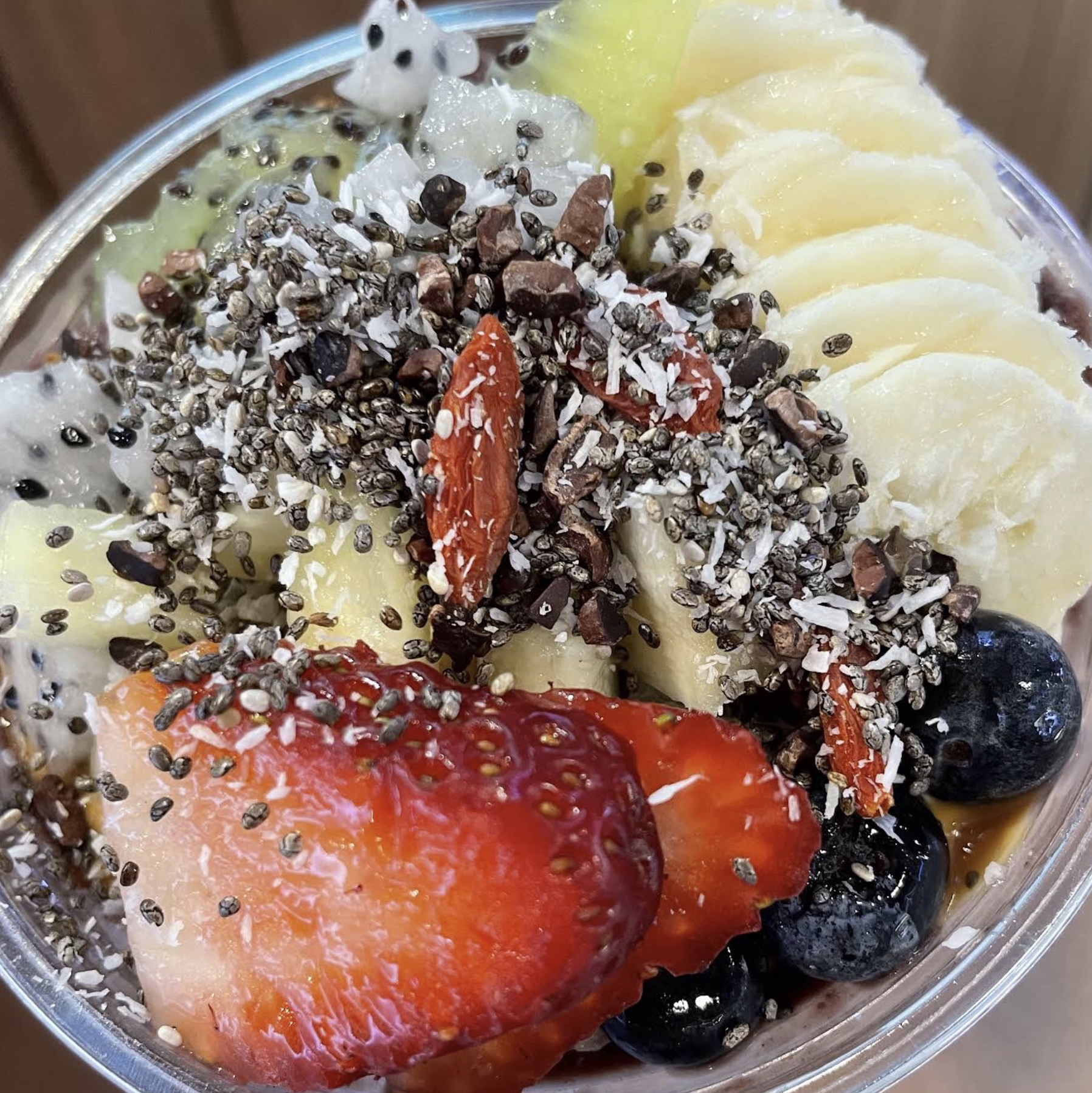 DIY acai bowl with nut butter drizzle and superfoods