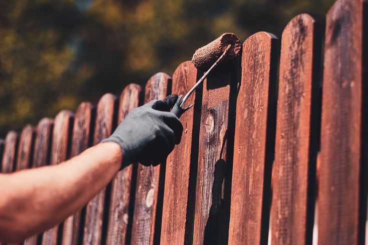 Fence staining service in Vancouver protecting wood grain