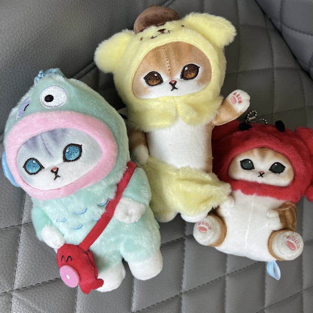 Cute character plush toys in colourful animal costumes