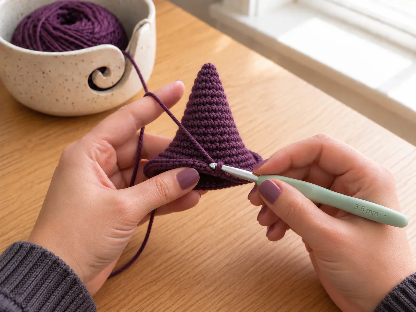 Crochet the brim — Work increase stitches around to create the witch-hat brim.