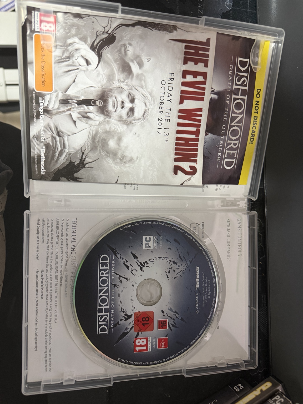 Death of the Outsider disc, leaflet and instructions inside the clear case