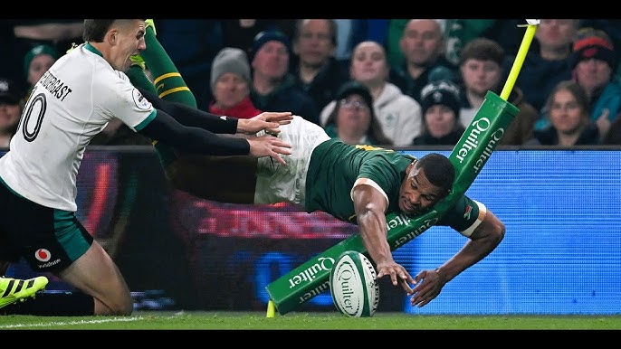 Rugby players competing fiercely during an international fixture