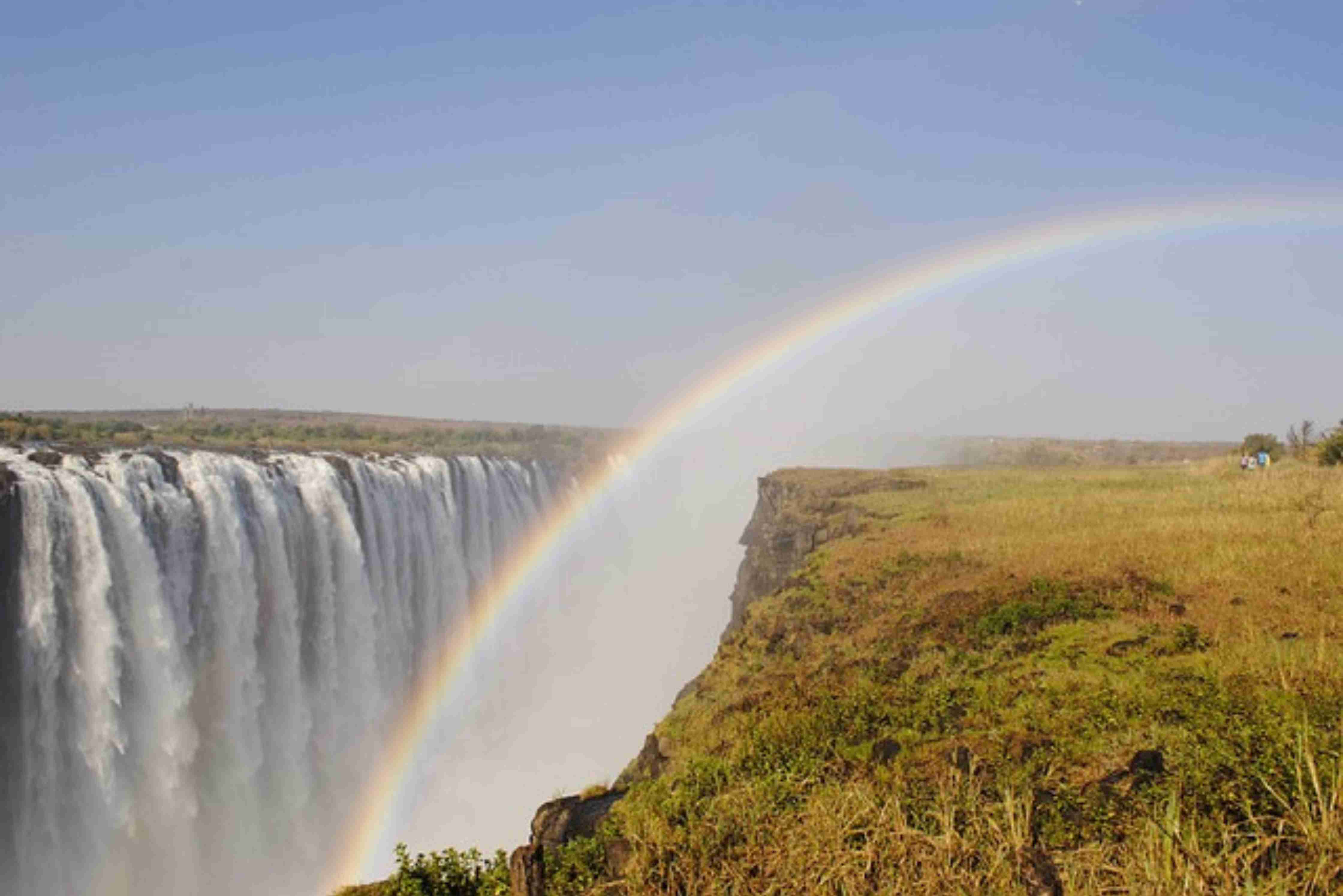 An image showing an aerial view of the cascading waterfalls of Victoria Falls.