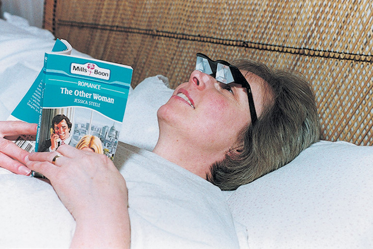 Image of a nanna reading a Mills & Boon novel