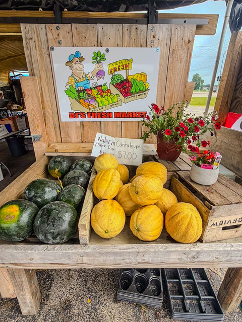 Watermelon and cantaloupe stacked on the table at DJ's Fresh Market, Appleton Wisconsin