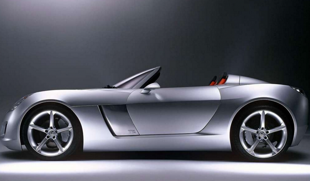 2003 Vauxhall VX Lightning Concept
«Сохраняйте это простым, чистым и красивым». Слова вице-президента GM Боба Лутца при запуске концепции солнцестояния в США. Это было основным требованием для нового концептуального автомобиля Vauxhall, VX Lightning.VX Lightning был представлен как центральный элемент празднования столетия компании. Это двухместный родстер, основанный на той же технической базе, что и концепция Pontiac Solstice, впервые представленная на Североамериканском международном автосалоне 2002 года в Детройте. Концепция родстера Vauxhall, однако, была разработана на британский вкус в британской студии передового дизайна GM в Мидлендсе.

Под длинным капотом VX Lightning находится новая версия полностью алюминиевого двигателя 2.2 ECOTEC Vauxhall, переработанного с помощью нагнетателя для максимальной мощности 240 л.с. и крутящего момента 305 Нм. Механическая коробка передач с шестью скоростями сопряжена с новым двигателем, который приводит в движение задние колеса. Шасси включает независимую подвеску, передняя часть использует простую и надежную конфигурацию стойки с реечной передачей.

В задней части независимая подвеска полностью алюминиевая для экономии веса. В целом, автомобиль управляет почти идеальным распределением веса 50:50 для лучшей управляемости и маневренности.

Кевин Уэйл, председатель и управляющий директор Vauxhall, говорит: «VX Lightning говорит все о том, куда направляется Vauxhall. Автомобиль представляет собой возвращение к нашим ранним характеристикам, когда Vauxhall был известен как производитель первого настоящего британского спортивного автомобиля - в то время как мы продолжаем быть инновационными и смелыми во внешнем и внутреннем дизайне. '

Дизайн
Разработанный в Великобритании, VX Lightning - это спортивный автомобиль классического размера с длинным капотом и коротким задним свесом.

Есть также некоторые тонкие отголоски прошлого, в том числе обручи при опрокидывании, изваянные на задней палубе, и кузов, который стекает в кабину.Приспособленный для автомобиля с присутствием VX Lightning, он сидит на 19-дюймовых легкосплавных дисках спереди (оснащенных шинами Michelin Pilot 245/35), в то время как сзади массивные 20-дюймовые сплавы оснащены шинами 255/35.

Внутри сиденья с глубокими скульптурами отделаны черной и красной кожей, а красная кожа также использовалась для отделки широкой панели приборов.

В настоящее время нет никаких планов по созданию концепции VX Lightning, однако Vauxhall будет внимательно следить за реакцией общественности на этот великолепный новый автомобиль.В деталях
двигатель	Модифицированный, с наддувом ECOTEC L850 Inline-4
позиция	Фронт
смещение	2200 куб.см / 134,3 дюйма
мощность	179,0 кВт / 240 л.с.
удельный вывод	109,09 л.с. за литр
л.с. / вес	182,09 л.с. на тонну
крутящий момент	305,06 нм / 225 футов фунтов
тело / рамка	Композитный корпус над стальным корпусом
ведомые колеса	RWD
передние шины	Michelin Pilot 245 / 35R19
задние шины	Michelin Pilot 255 / 35R20
передние тормоза	Диски
размер тормоза f	мм / дюйм
задние тормоза	Диски
размер тормоза r	мм / дюйм
передние колеса	F 48,3 x 21,6 см / 19,0 x 8,5 дюйма
задние колеса	R 50,8 х 22,9 см / 20 х 9 дюймов
подвеска	Макферсон Струц
г подвеска	Independant
снаряженная масса	1318 кг / 2906 фунтов
колесная база	2415 мм / 95,1 дюйма
передняя колея	1532 мм / 60,3 дюйма
задняя колея	1537 мм / 60,5 дюйма
длина	4100 мм / 161,4 дюйма
ширина	1808 мм / 71,2 дюйма
высота	1140 мм / 44,9 дюйма
коробка передач	GM T56, 6-ступенчатая механическая коробка передач
передаточные числа	: 1