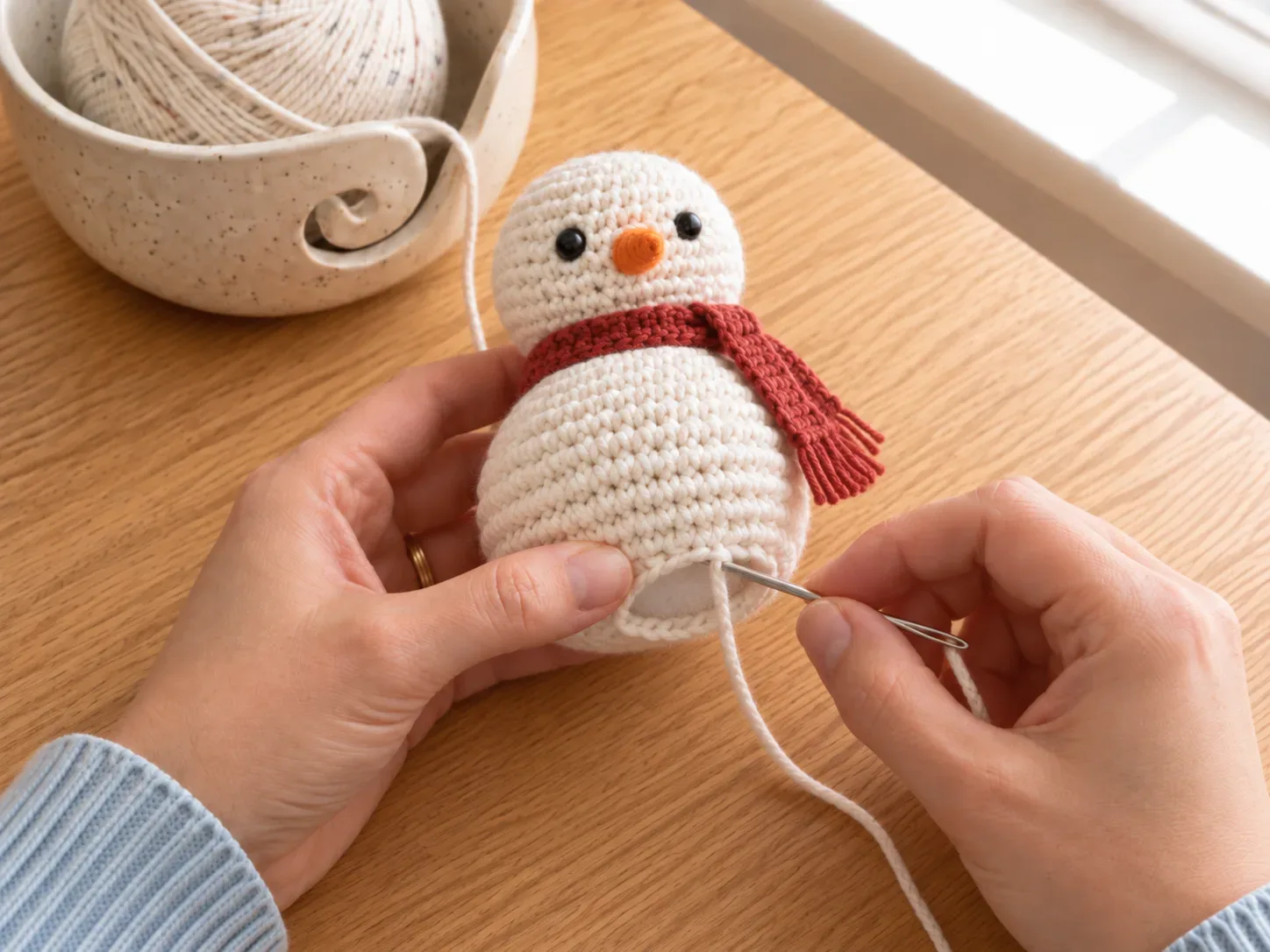 Close and shape — Finish the base and gently shape both snowball sections.