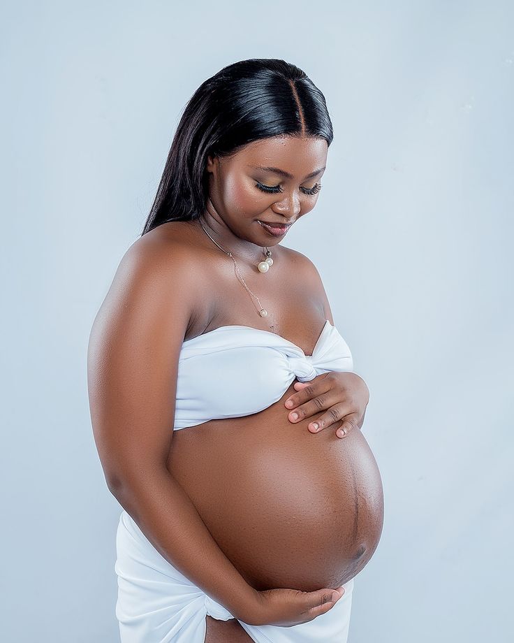 Pregnant woman preparing a healthy meal at home
