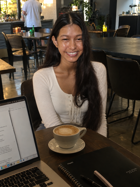 Portrait of Deepali Rawat at a café workspace