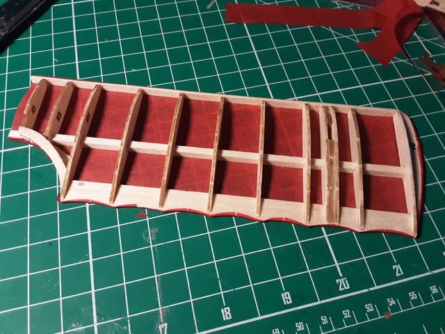 Here's the wing with the overlap glued down, dried, and ready for covering the top. It's best to not try to get everything done in one step.
