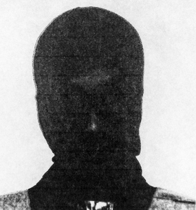 A woman in full leather face mask