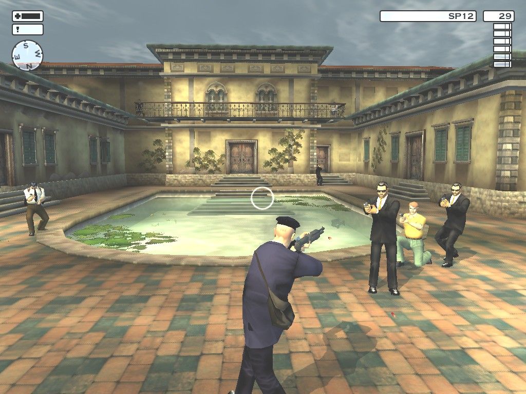 Agent 47 wearing a postman's uniform and aiming a shotgun in a villa courtyard