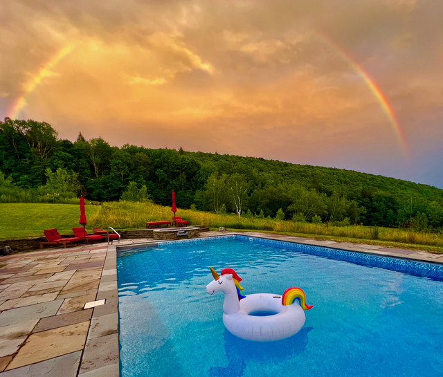 Wedding ceremony by the pond at Mountain Meadows Catskills