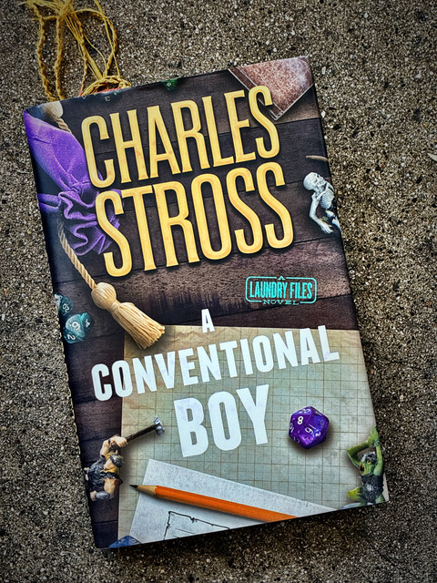 Cover of the collection “A Conventional Boy” by Charles Stross