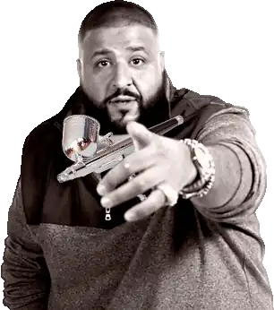 A picture of DJ Khaled edited to be holding an airbrush gun.