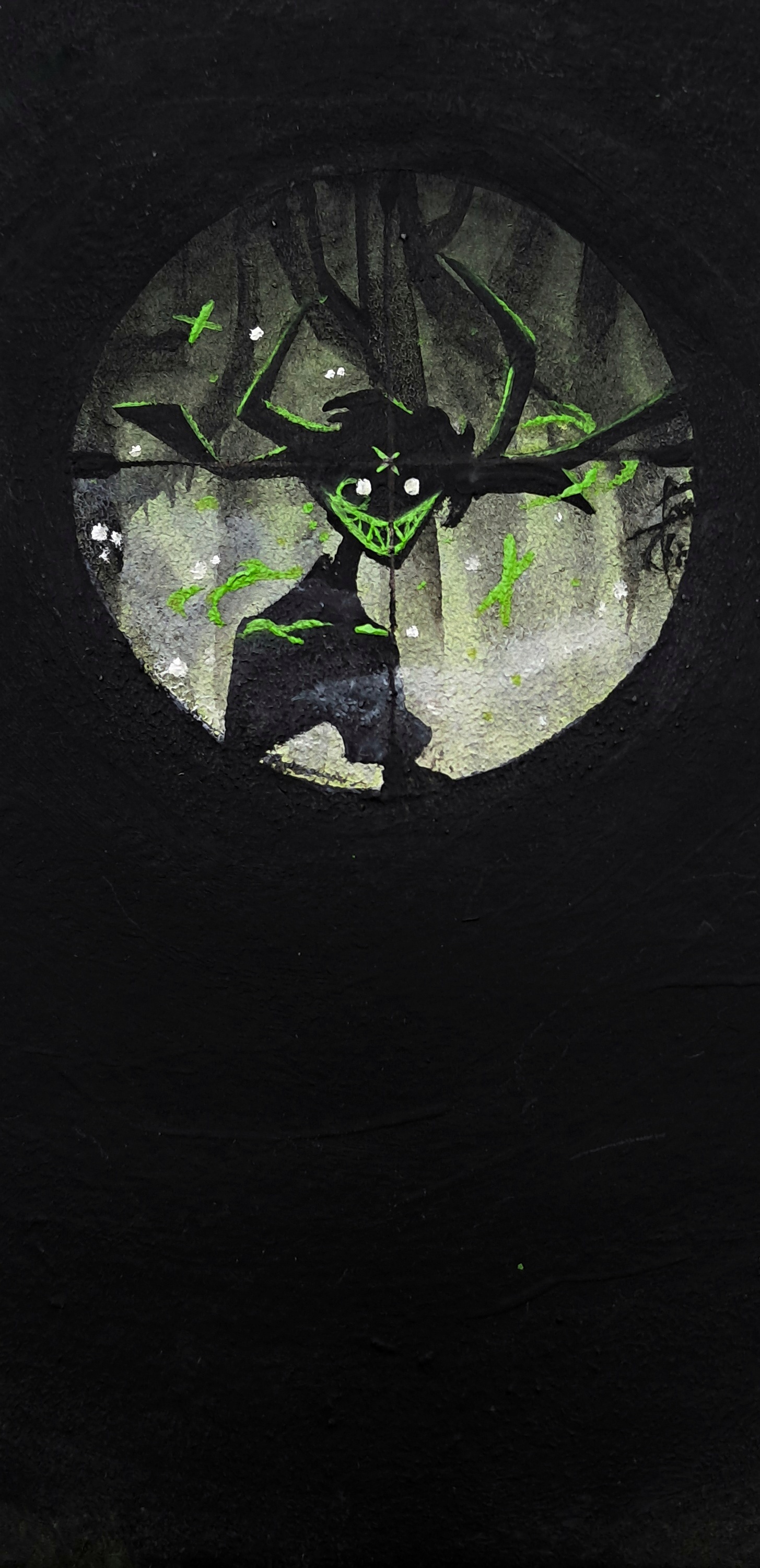  A repaint it human alastor in a scope circle, with branches like antlers behind him.
