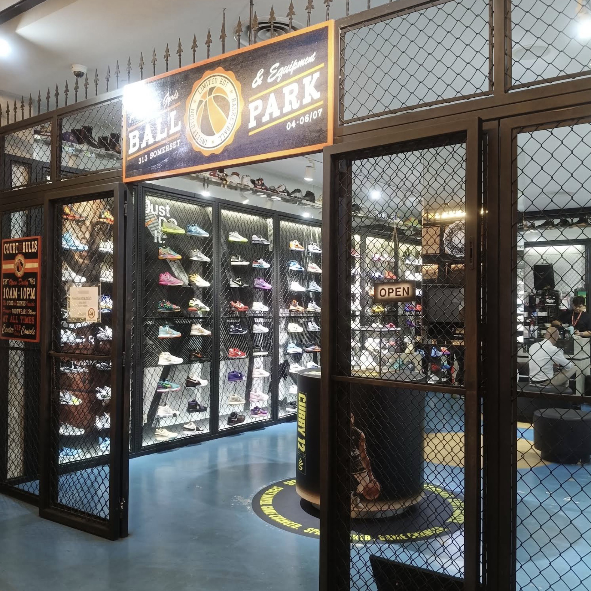 Basketball sneakers and New Era caps at L.E. Ball Park