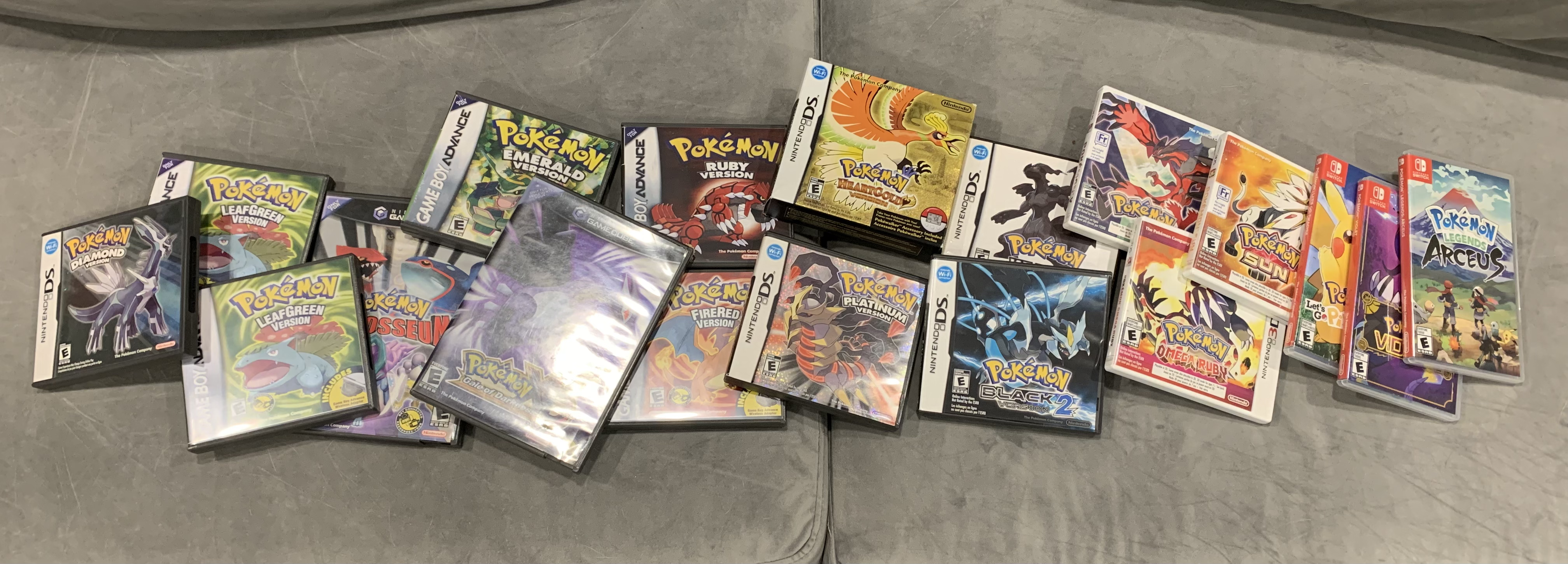 A pile of every physical Pokemon game I own right now. There are 18 game cases.
