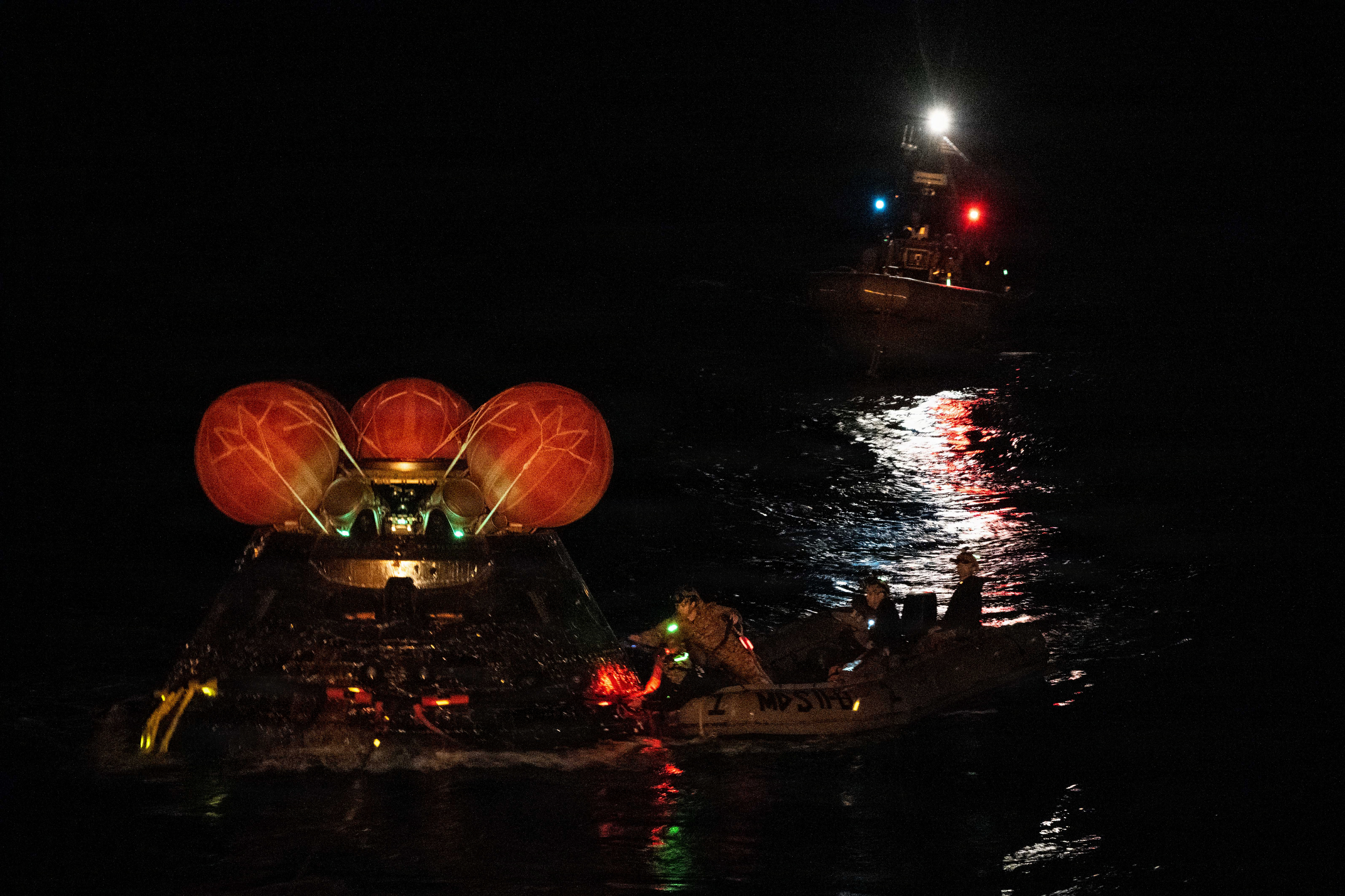 Sailors and divers recover Orion crew module