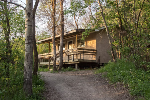 A cabin at a summer camp in the forest.