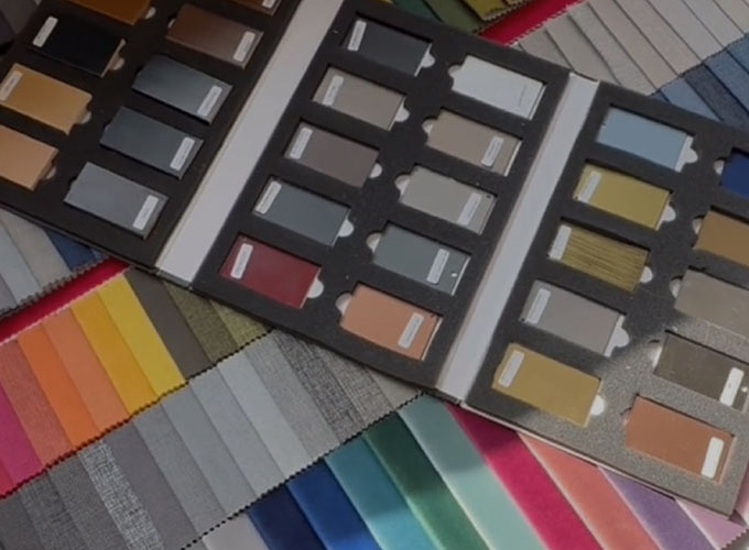 Colourful upholstery fabric swatches and sample books