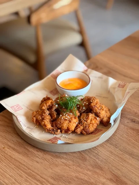 Crispy golden chicken with house dipping sauces