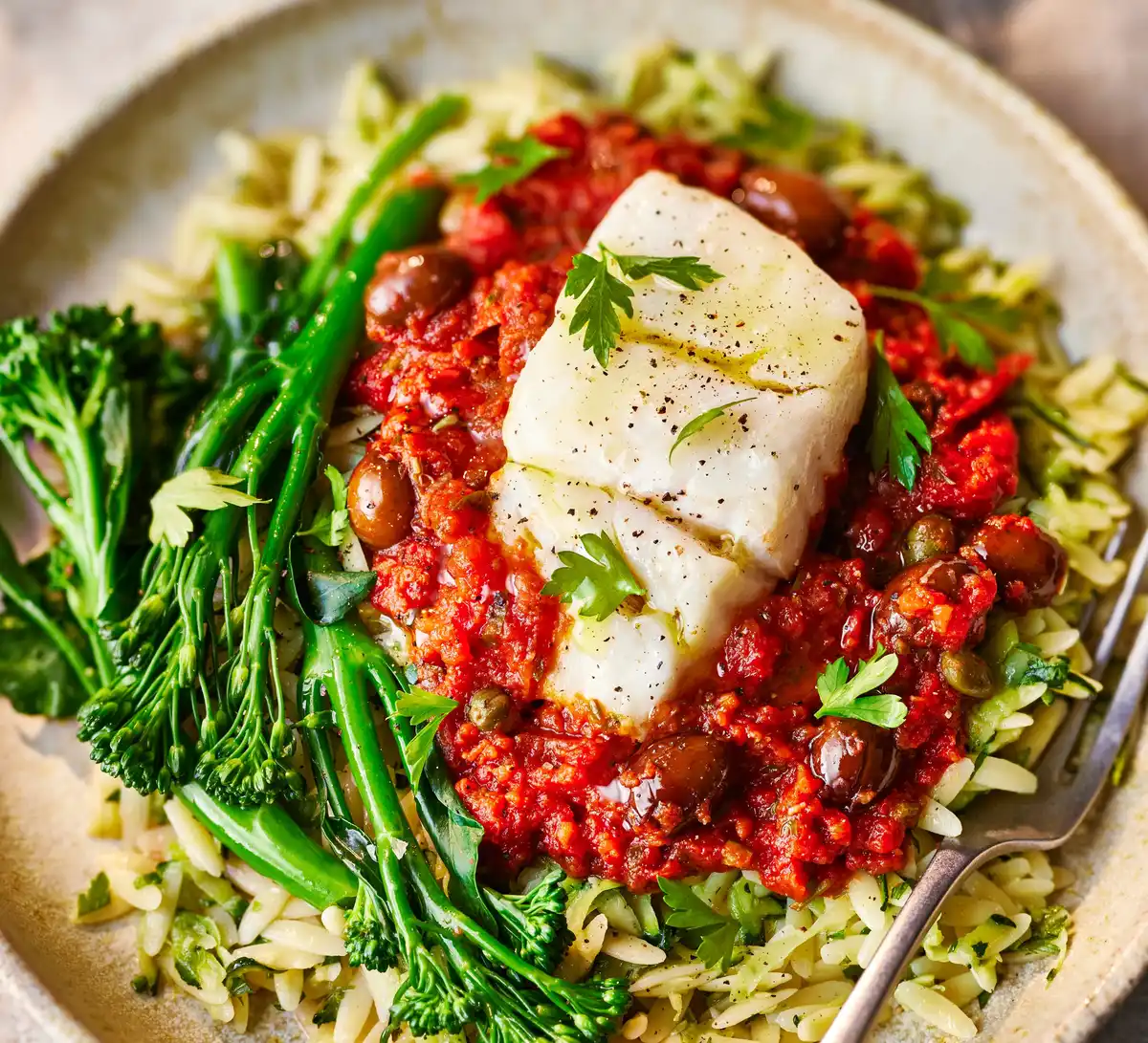 Puttanesca Baked Cod with Lemony Courgette Orzo