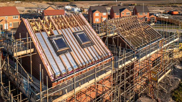 Aerial view of new build home under construction in the UK showing modern design energy efficiency and low maintenance appeal that attract retirees seeking comfort and convenience