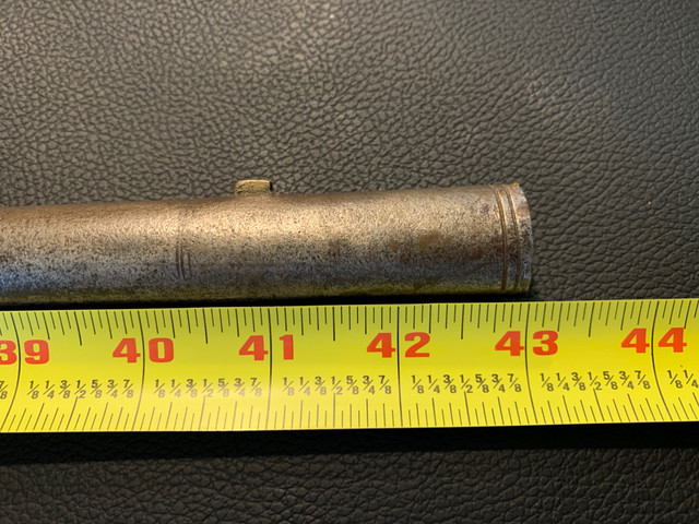 The barrel is octagon for 1/3 length and then round. Was held to the stock with pins through small rings attached to the bottom of the barrel.
