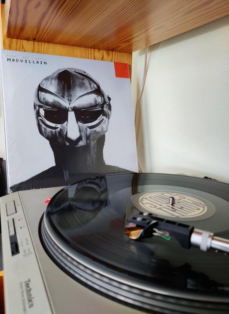 Technics SL-D202 turntable playing a Madvillain record
