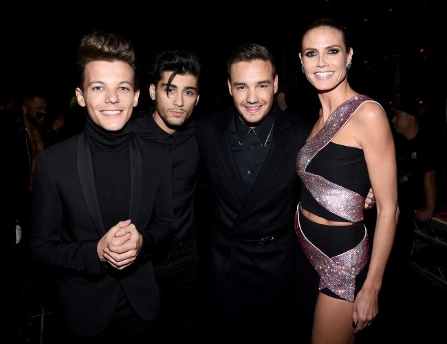 Malik y Payne, fotografiados aquí en diciembre de 2013 con Tomlinson y Heidi Klum, tuvieron un pasado complicado.Imágenes Getty para DCP