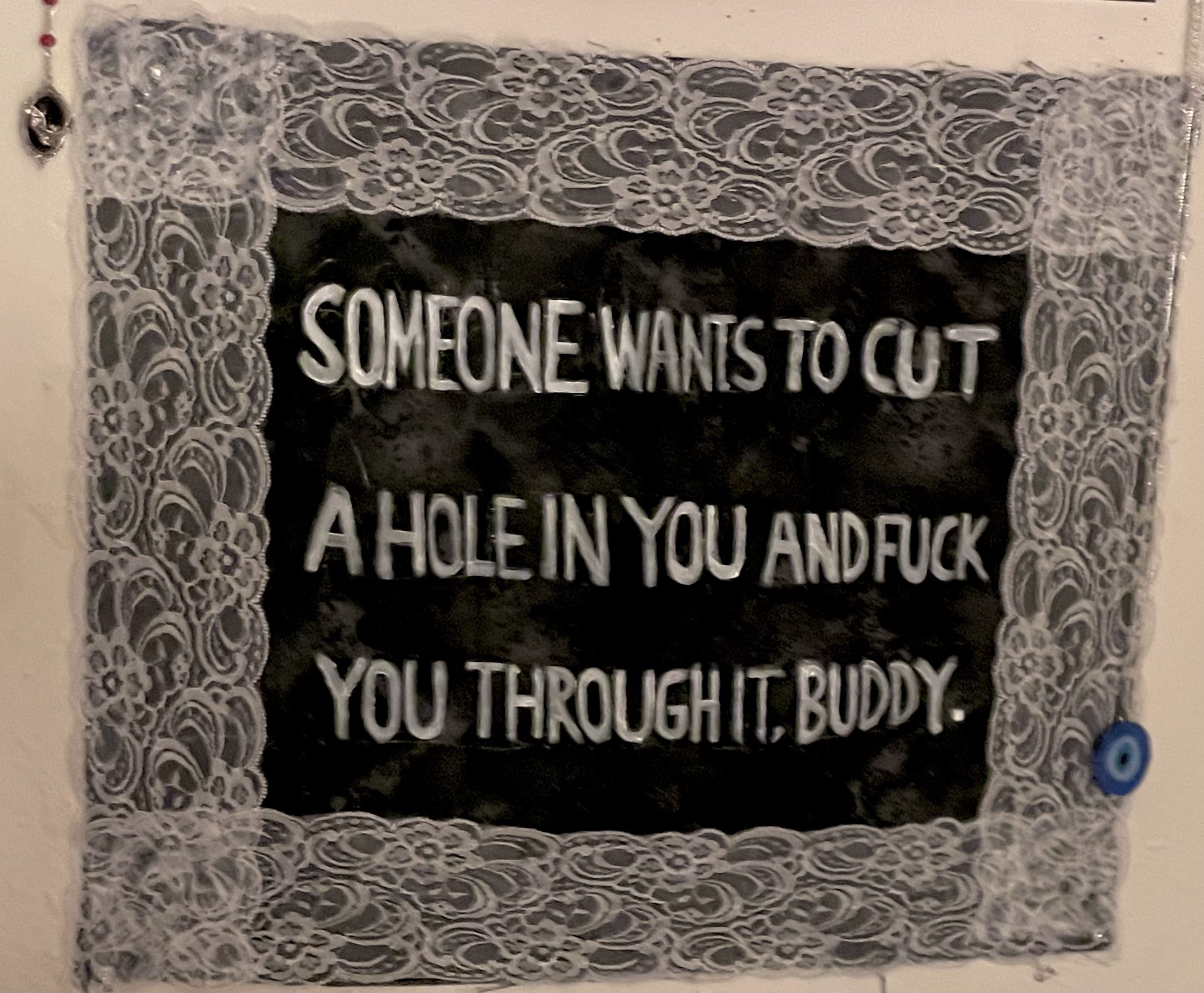 black tapestry that says 'someone wants to cut a hole in you and fuck you through it, buddy.'