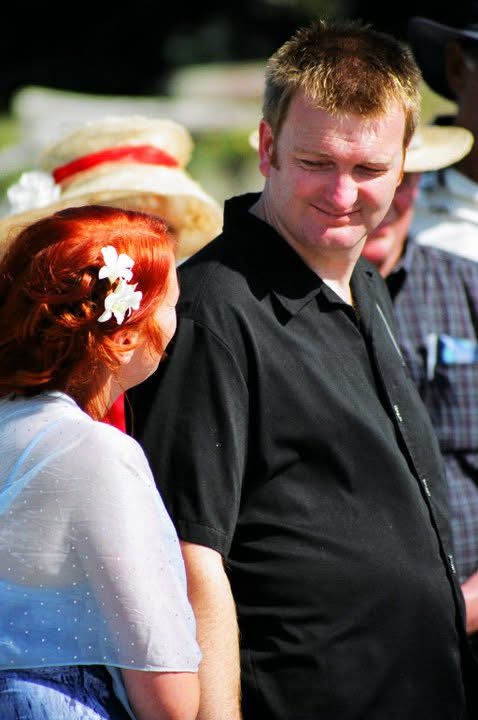 Sam looking down at Donna with quiet tenderness