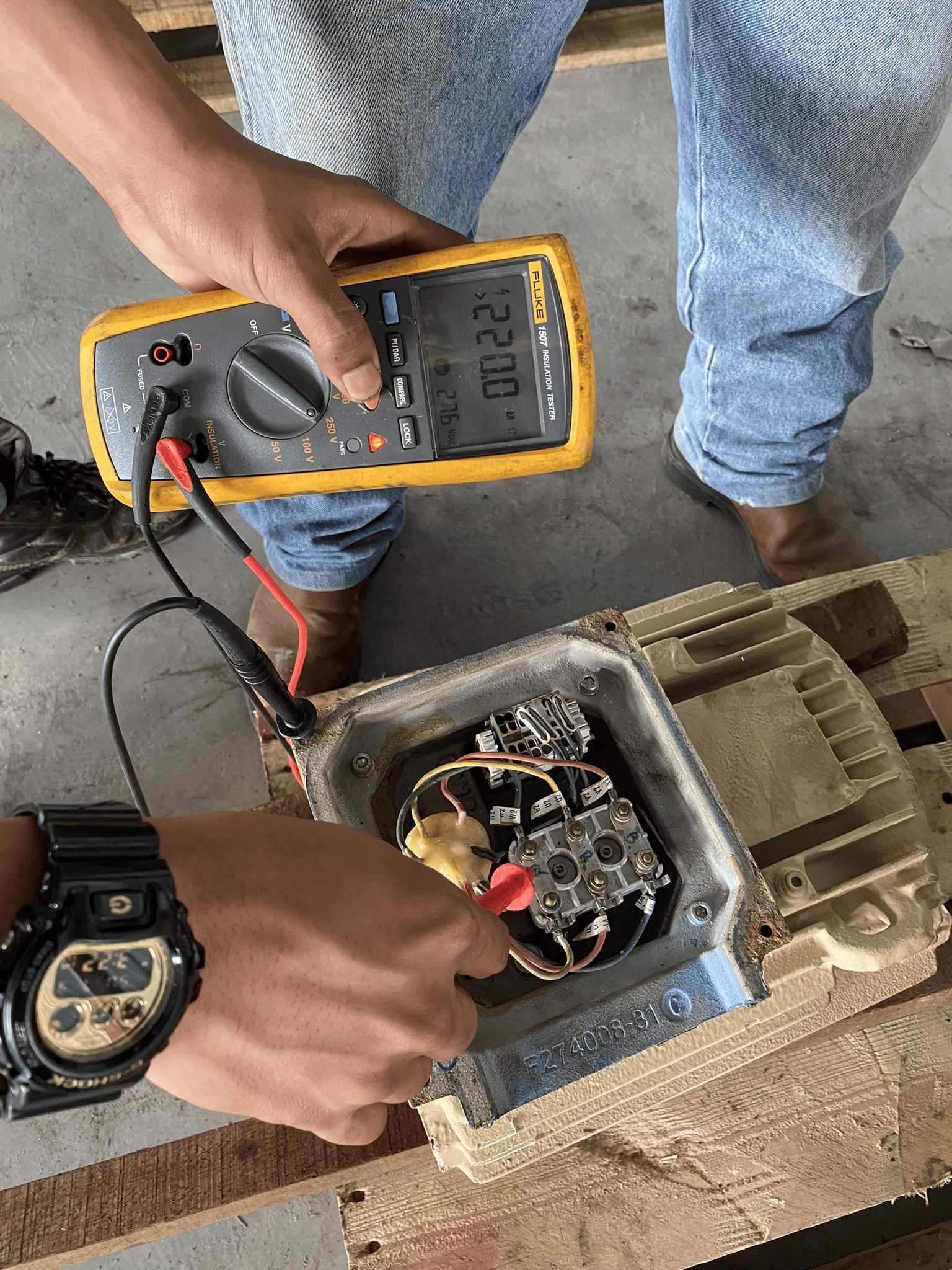 High voltage surge testing being conducted on repaired motor winding