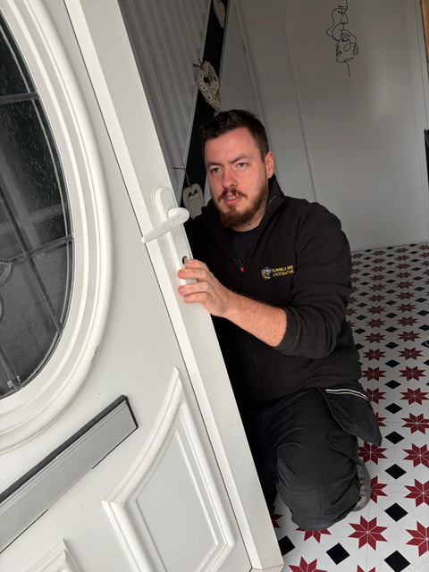 Locksmith inspecting a door