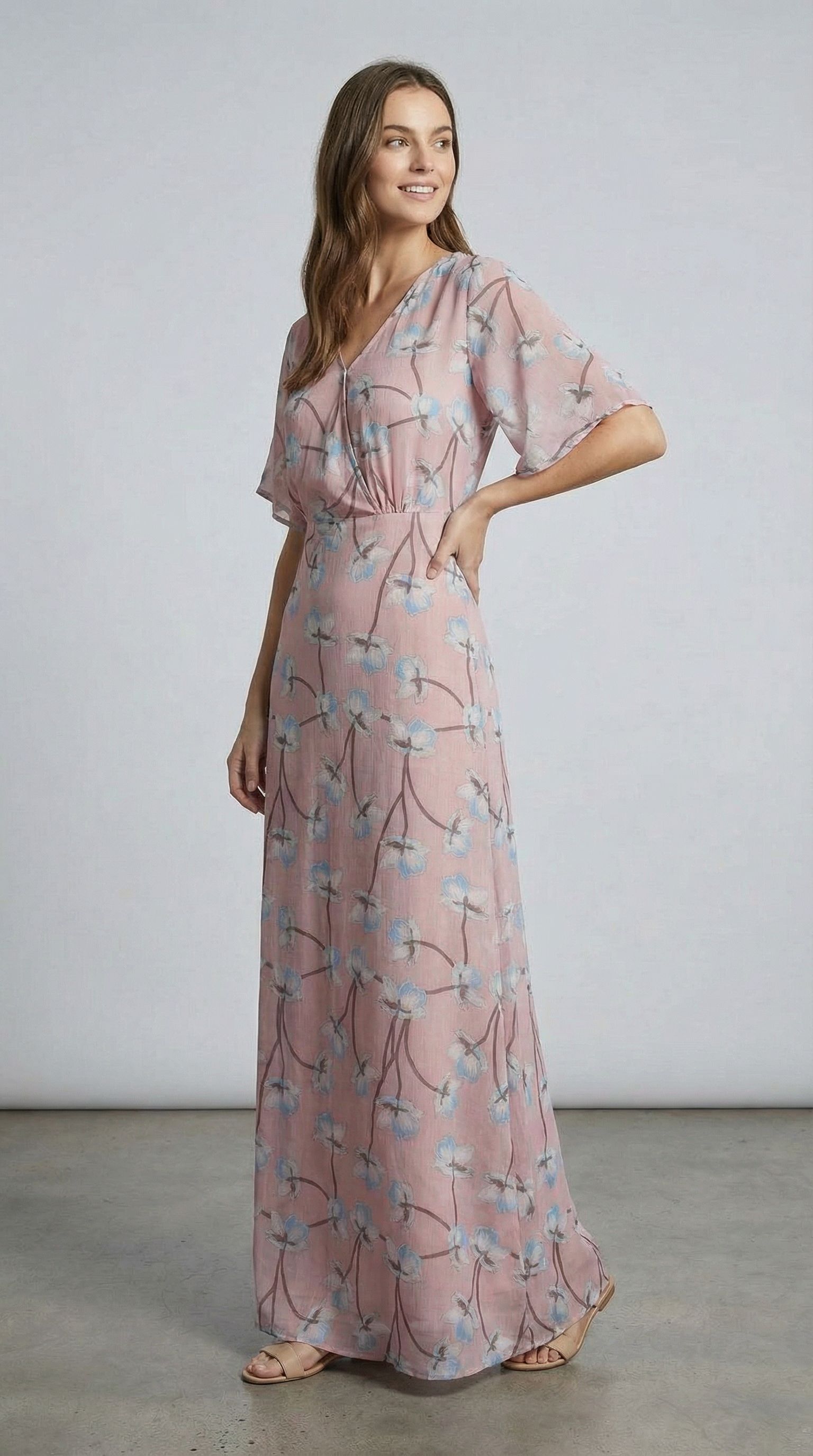 Model in an elegant pink floral dress