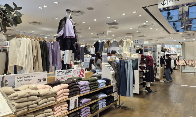 Clothing racks and apparel displays inside UNIQLO Orchard Central