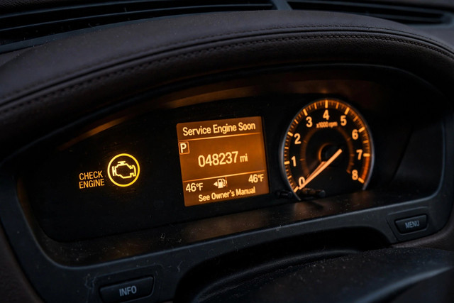 Car dashboard with check-engine light
