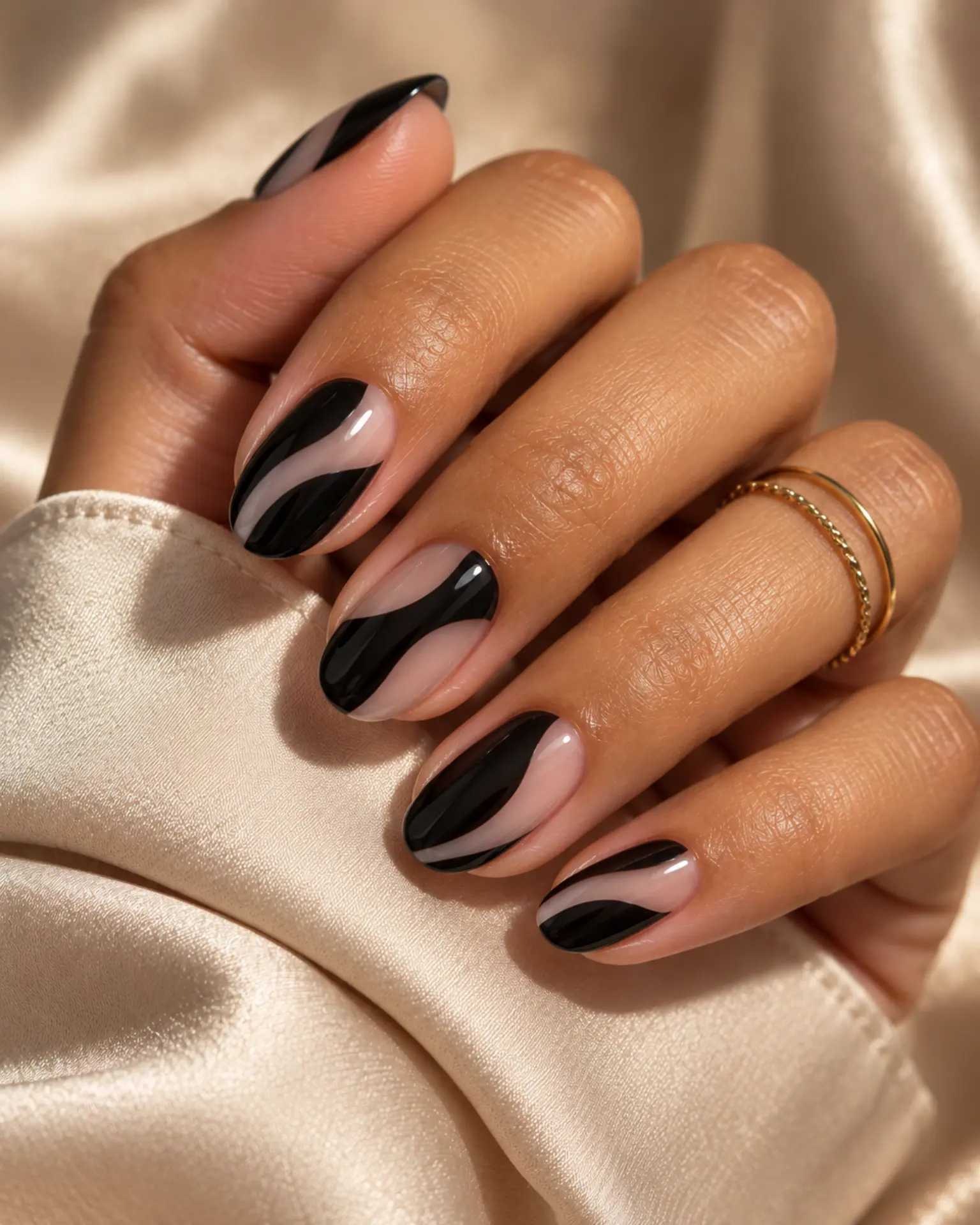 Black Negative-Space Curve manicure inspiration for black nail ideas