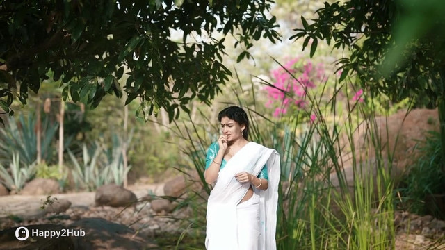 Resmi-R-Nair-Teasing-In-White-Saree-8
